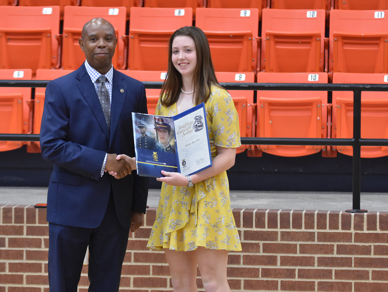 Dr. Cleveland Brown presented an appointment to the United States Coast Guard Academy to Arwen Wise at the May 9 Aledo High School Senior Awards.