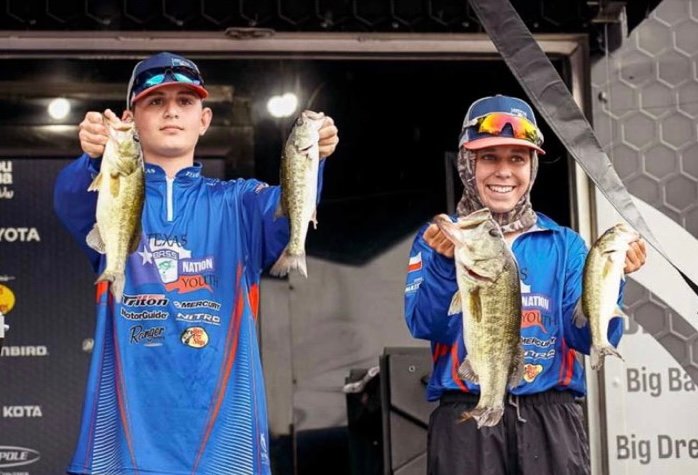 Mark Cerja, Jr. (right) and his partner Gus Richardson (left) show off their catch after winning the Bassmaster Junior National Championship.