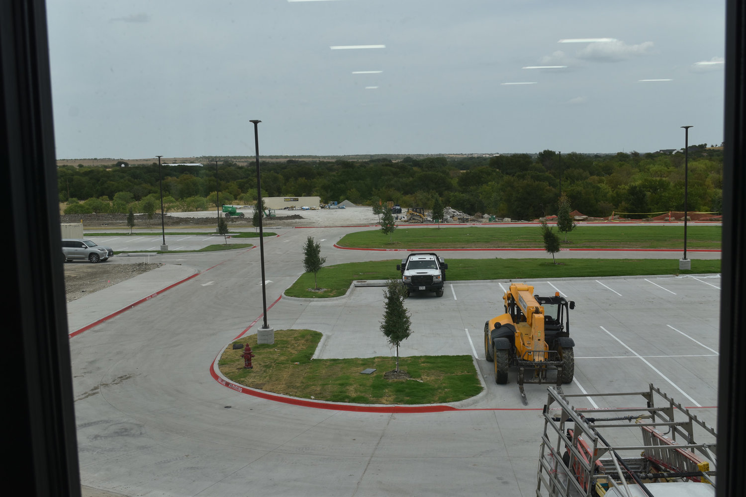View of parking lot from upstairs hallway