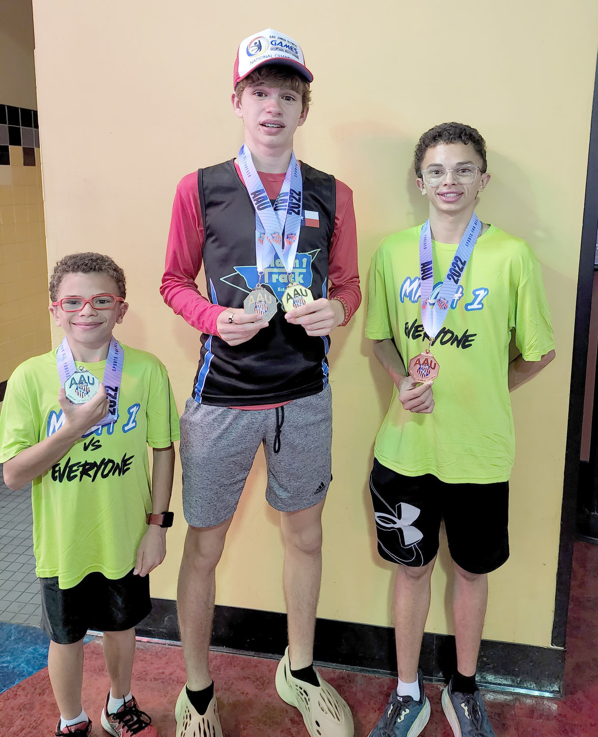 From left: Josh Fink of Aledo won a silver medal, Granbury's Gannon Dolan) set a national record, and Jack Fink of Aledo placed fifth in their respective divisions for Mach I Track Club in Weatherford at the recent AAU Junior Olympics in North Carolina.