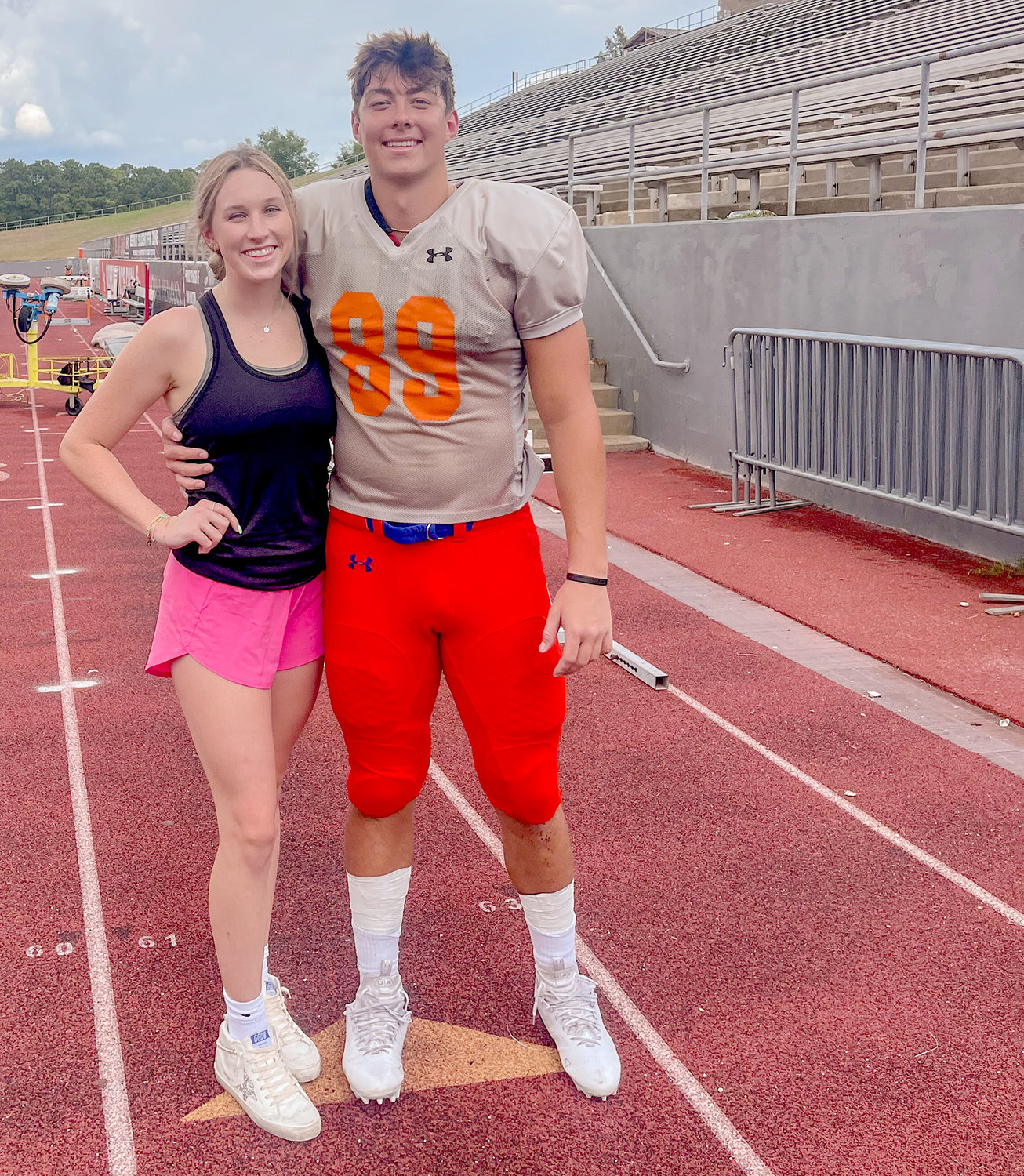 Former Aledo Bearcat state swimming champion Elijah Sohn is switching from swimming to football and transferred from SMU to Sam Houston State. He is pictured with his girlfriend Sydney Stafford following a preseason scrimmage. The Bearkats open the season Saturday at Texas A&M, where Sohn began his college career.