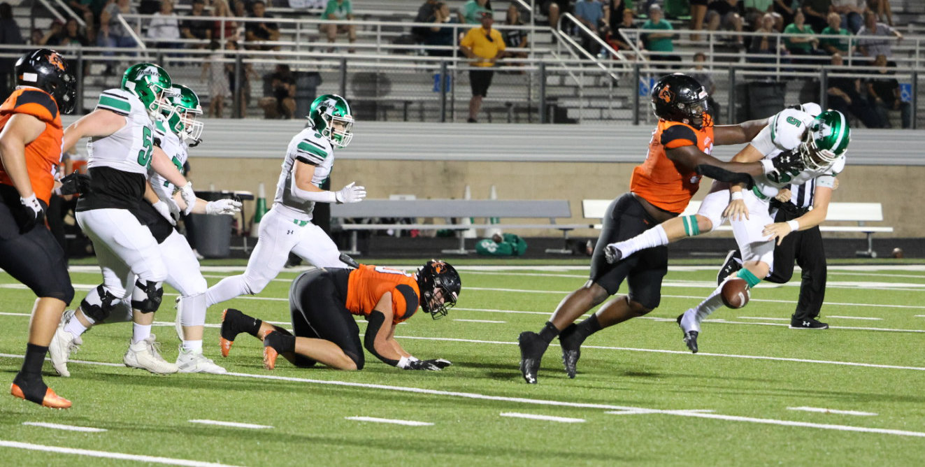 Aledo defensive tackle Ansel Din-Mbuh causes an Azle fumble in action at Bearcat Stadium on Friday, Sept. 16.
