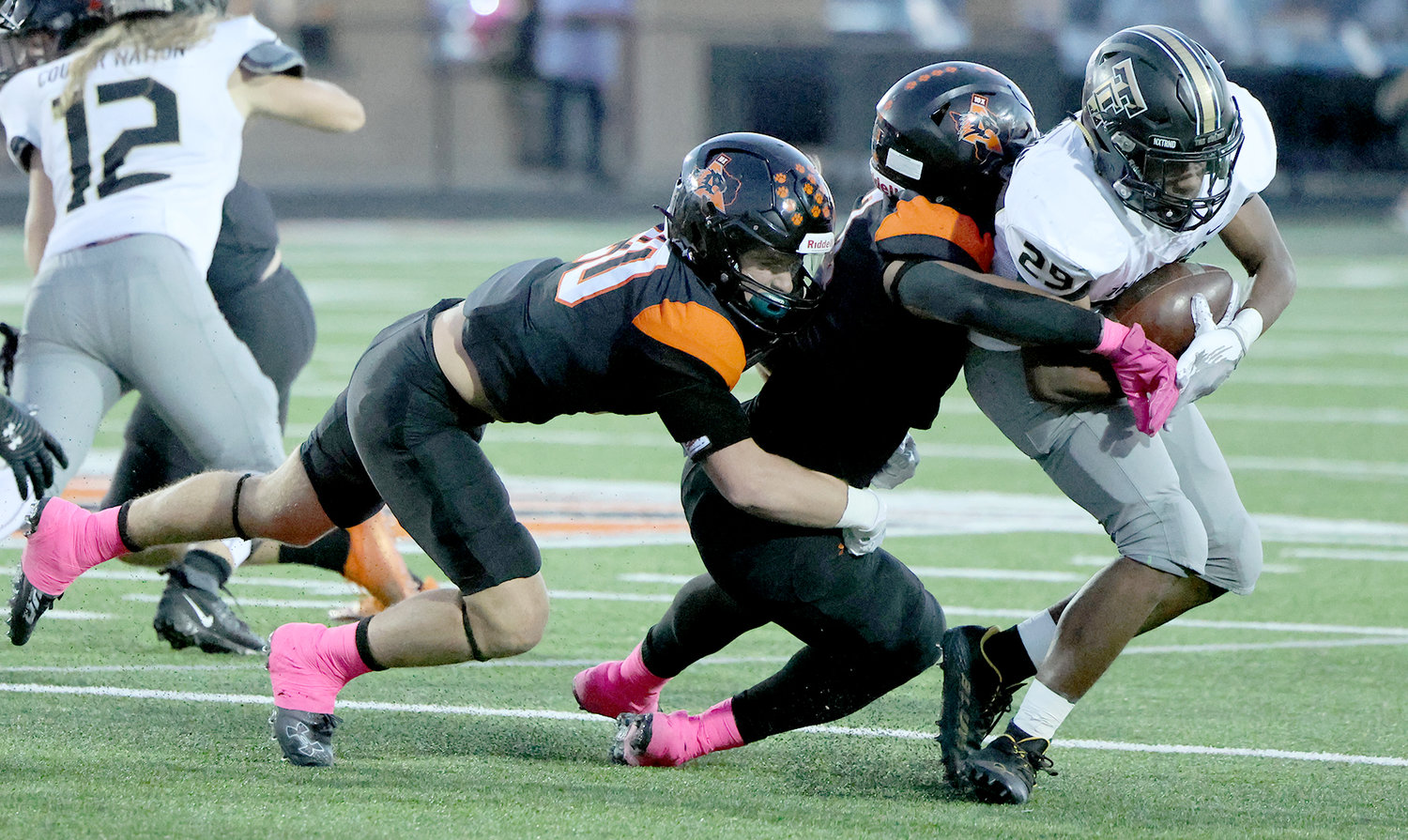 Davhon Keys (3) and Cap Mooney (20) make a tackle against The Colony.
