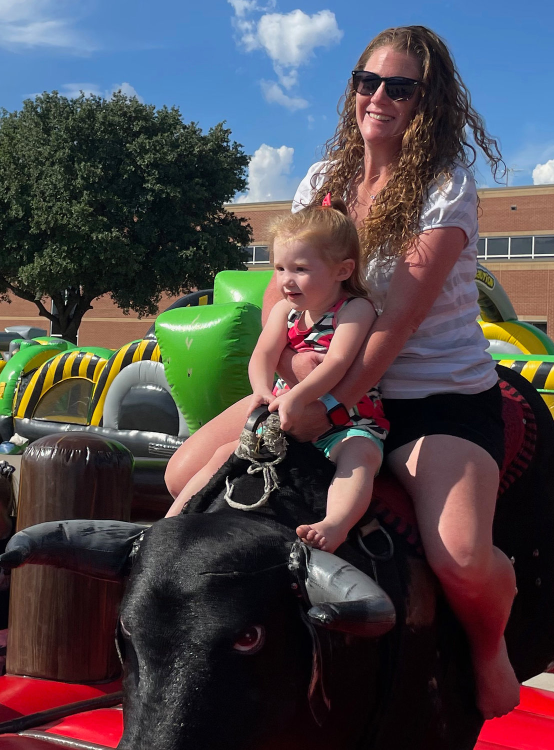 Kristen Lawler and daughter Hazel took a wild bull ride at the annual Aledo Fest, held Saturday, Oct. 15, at Aledo High School.