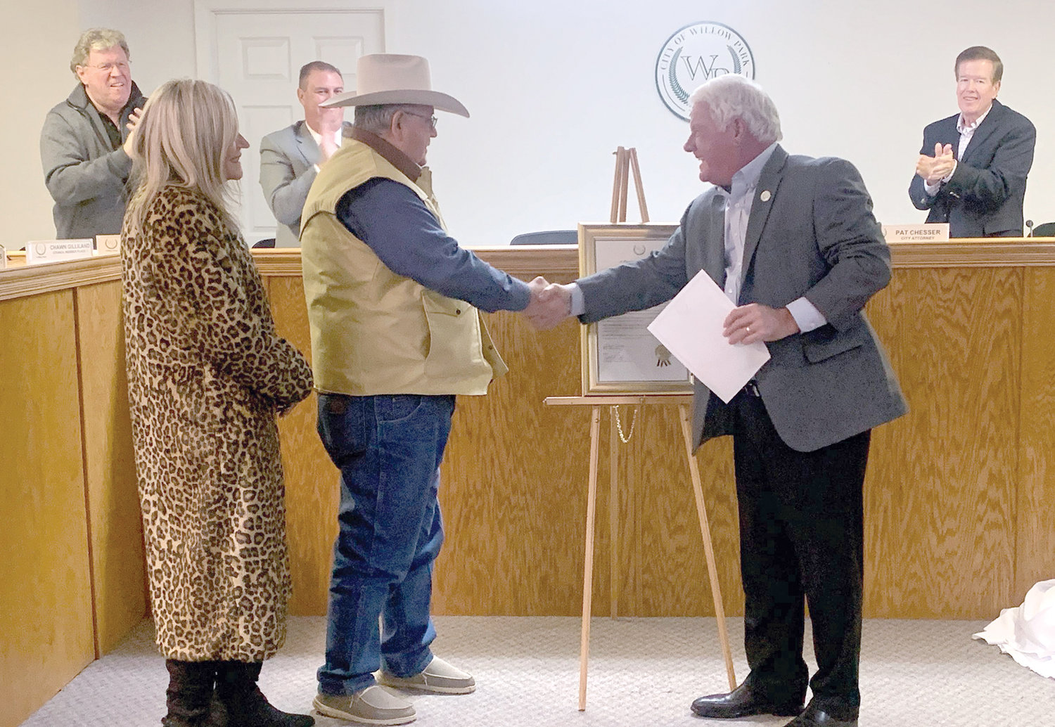 Jim Martin (center), shown with his wife, Pat, was honored with a proclamation by Willow Park Mayor Doyle Moss (right) at the start of Tuesday's city council meeting.