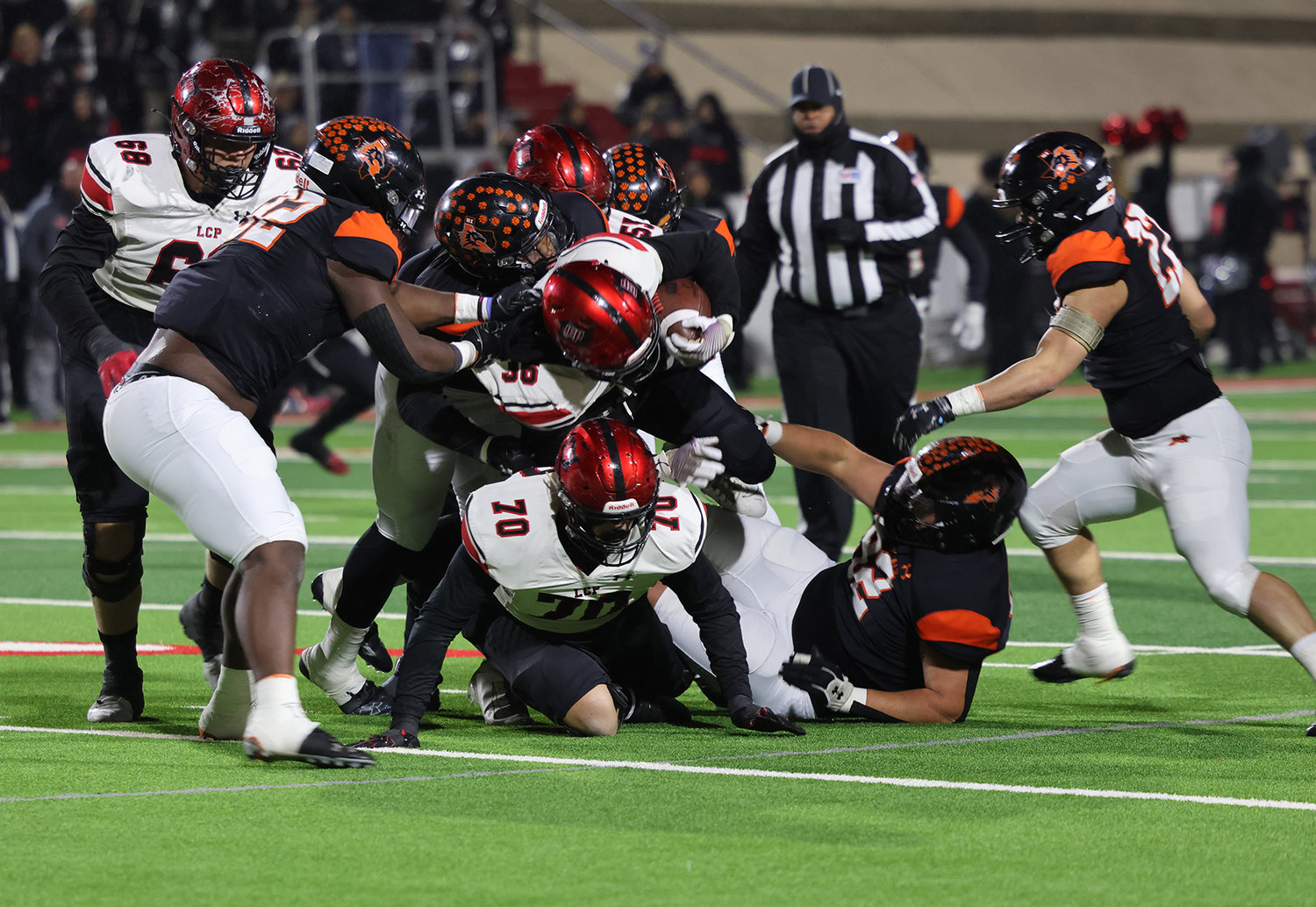 The Bearcats' defense converges on a Cooper ball carrier.