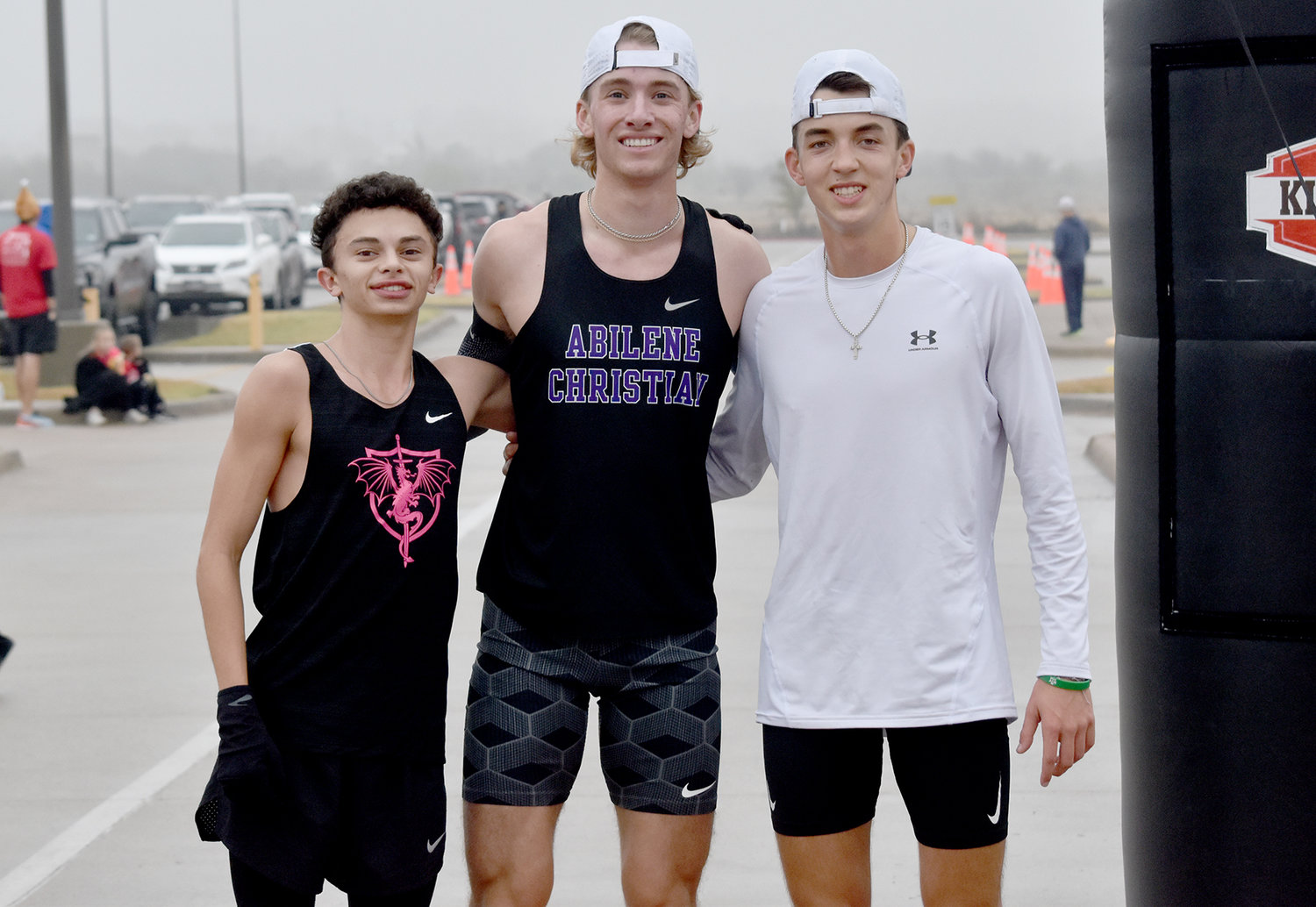 Top finishers of the 5K were (from left) Aledo High School student Jack Fink (third); Abilene Christian University runner and AHS graduate Cooper Goggans (first); and Texas A&M runner and AHS graduate Bryceson Boss (second).
