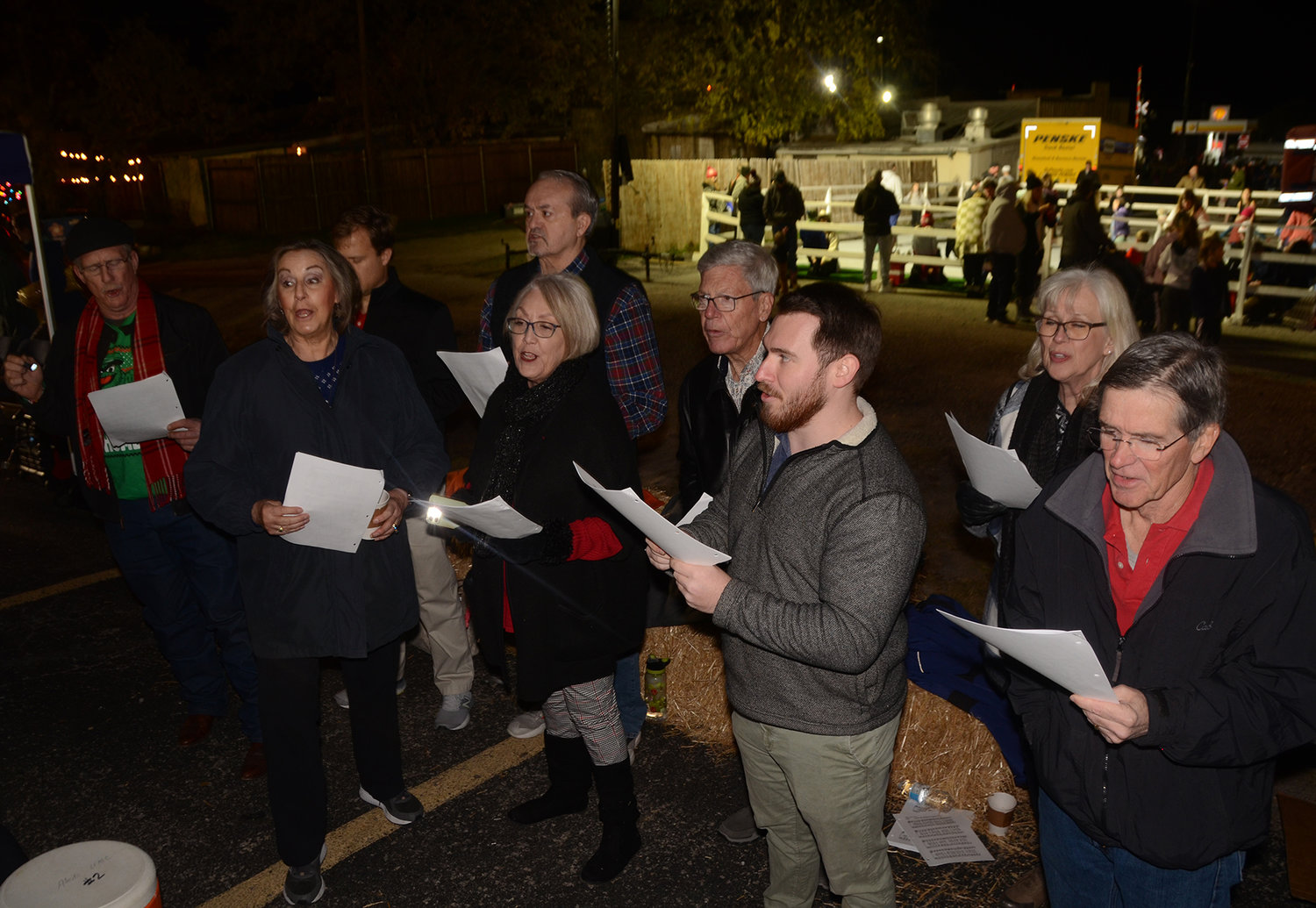Aledo United Methodist Church members sing “Oh! Holy Night” at the church's free hot chocolate booth.