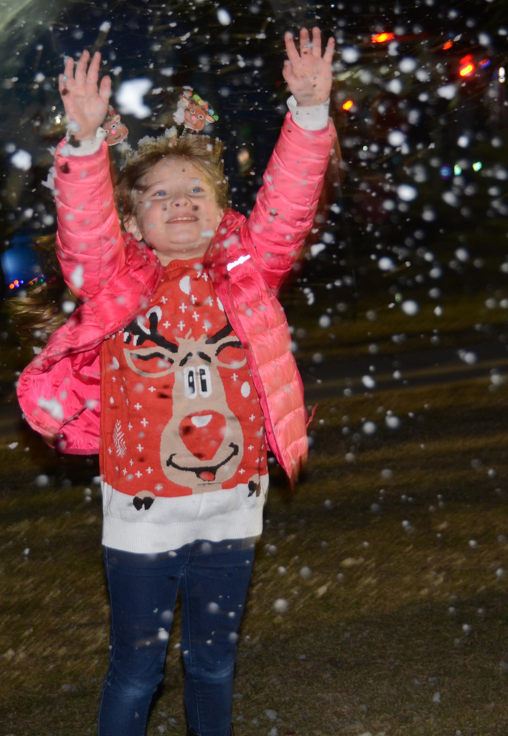 McCall Elementary School student Addison Bruns jumps and dances under an artificial snow machine.