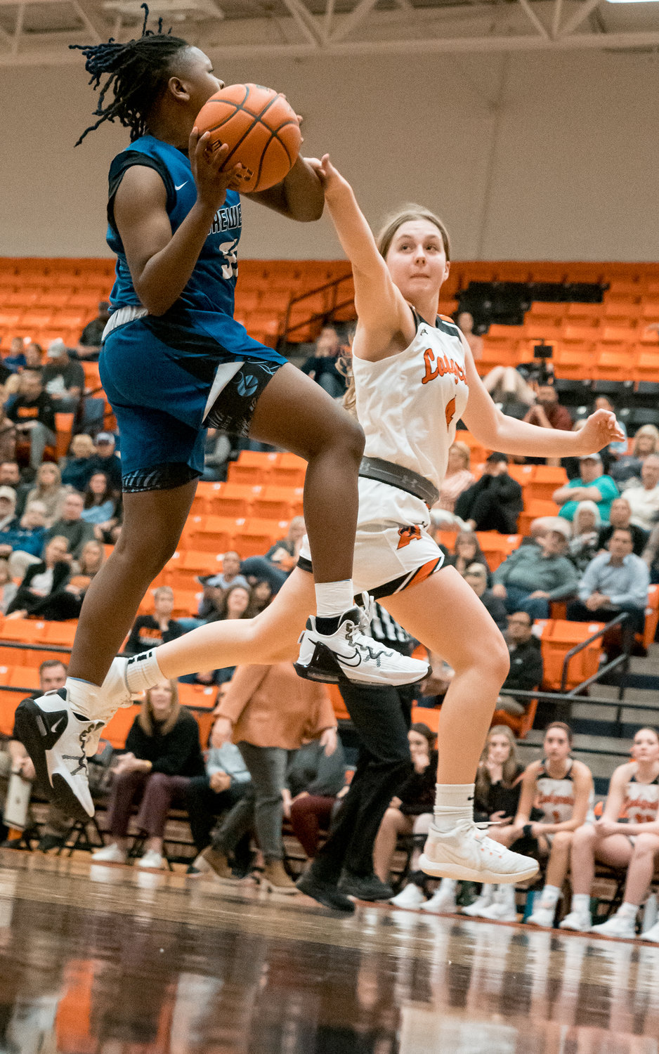Kenzie Grau attempts to stop a Brewer layup on Jan. 6.