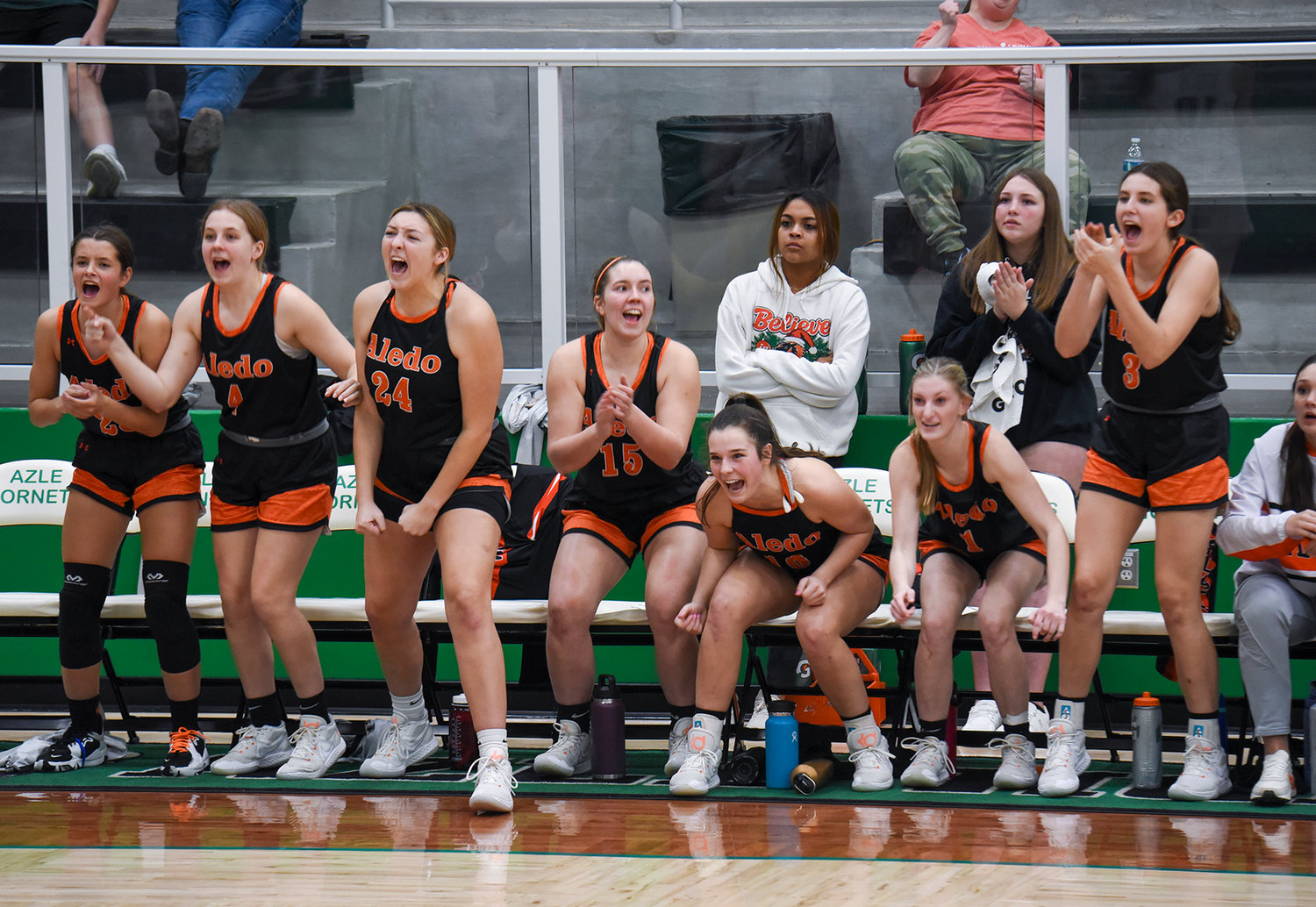 The Ladycats varsity basketballtTeam cheered with excitment when the team tied Azle 36-36 in the fourth quarter of their home game on Tuesday, Jan. 10.. The Ladycats went on to win the game 47-38.