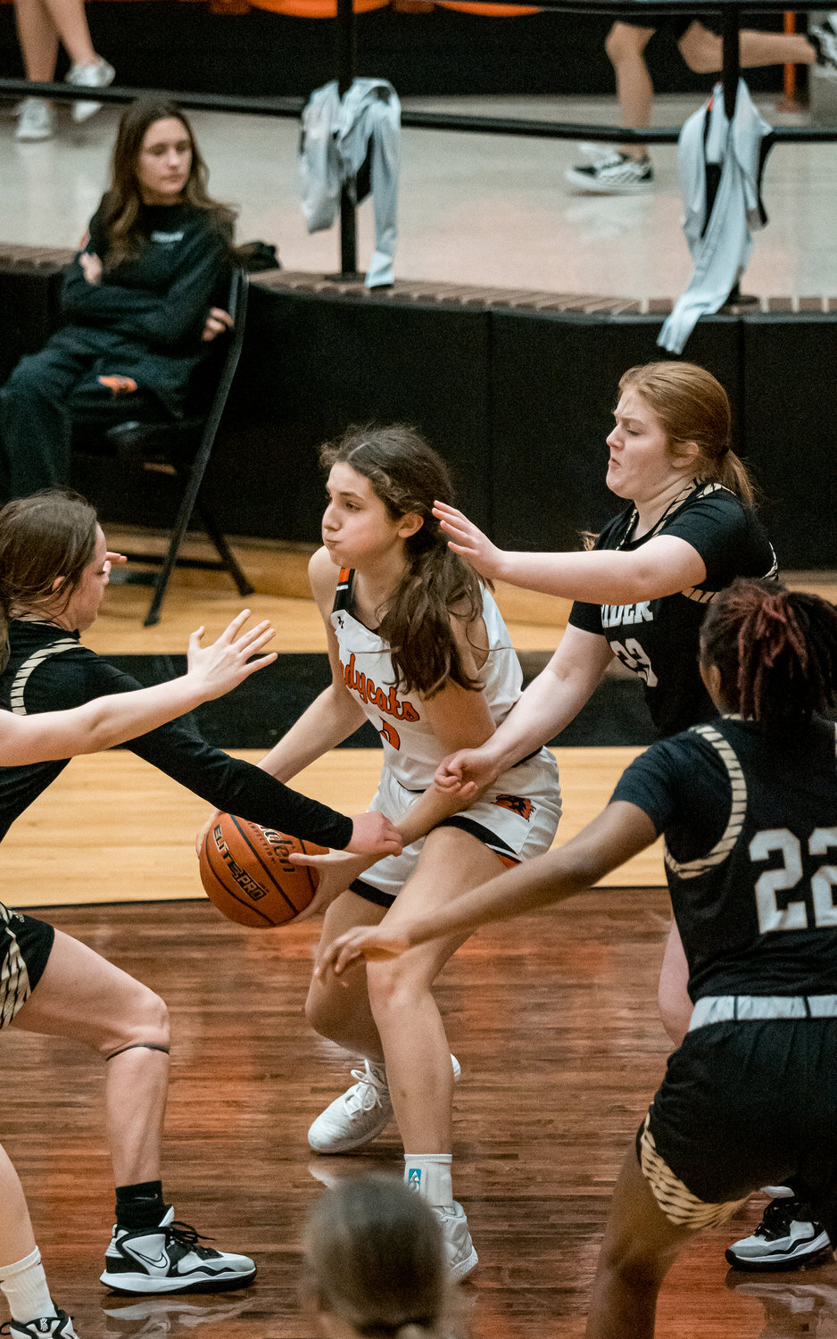 Ladycat guard Ella Isbell fights off a horde of defenders during the varsity game against Wichita Falls Rider on Tuesday, Jan. 17. Aledo won the game 56-32.