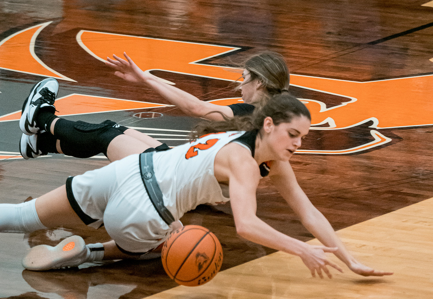 Reagan Davis scrambles for a loose ball after causing a turnover during the girls varsity game on Tuesday, Jan. 17.