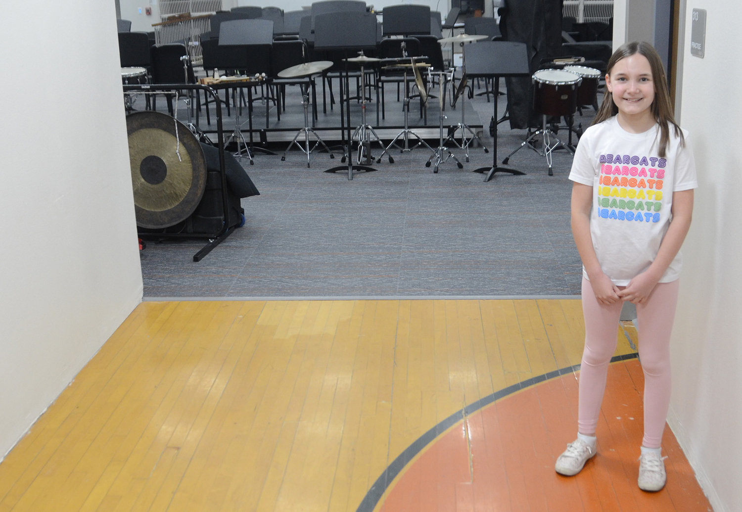 With a newly built gym and the original Multi Purpose Center gym remodeled, the band hall was built on the location of the old gym. Sixth-grade clarinet player Lily Elgin stands on the original gym floor in the entrance of the new music hall.