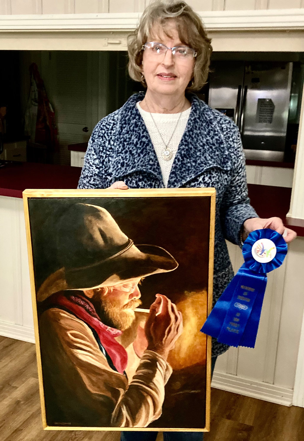 Linda W. Young shows her first-place entry, “ ...And  A Good Cup of Coffee.”