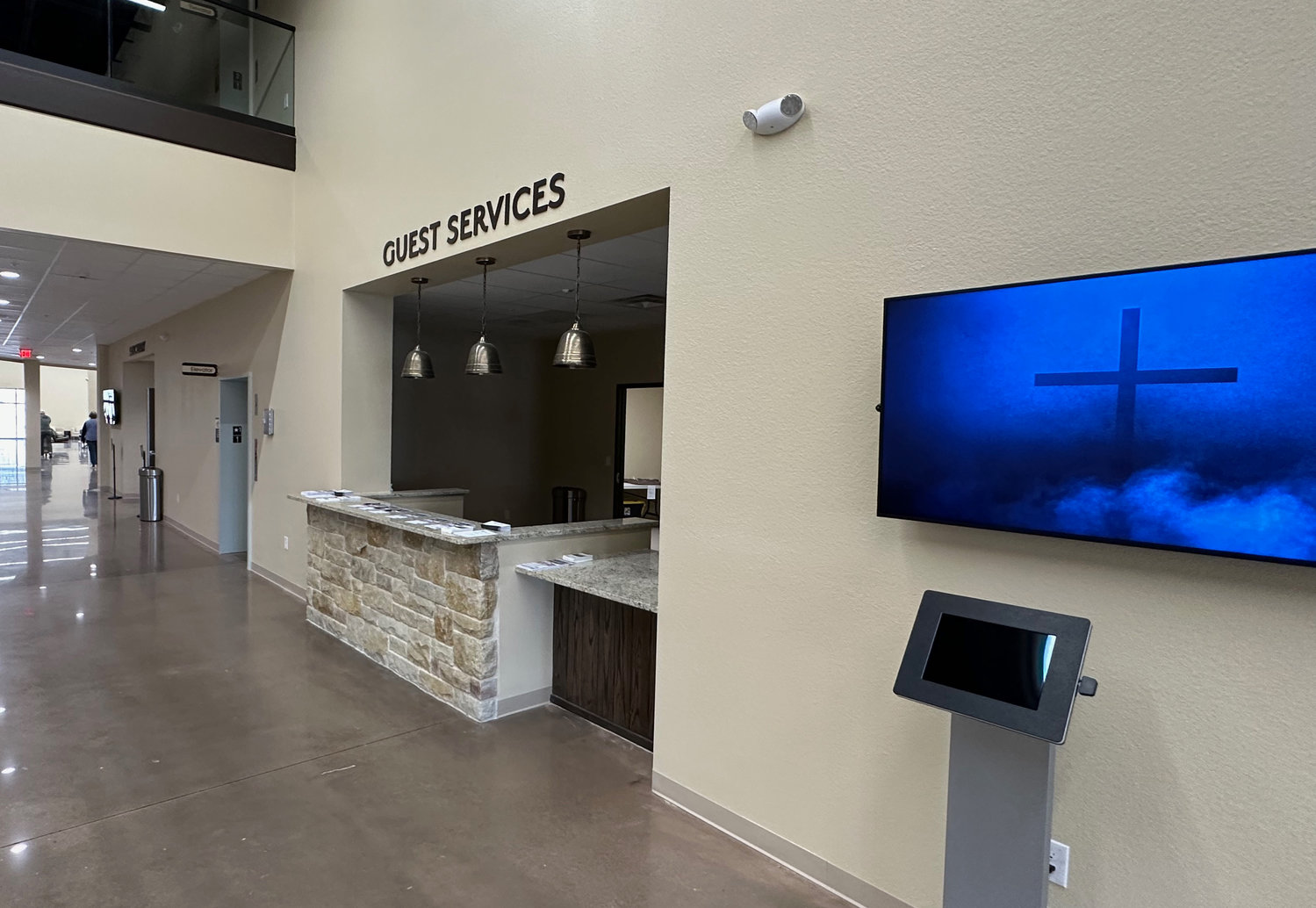 The new church has a guest services area on the way to the atrium. There are four entrances to the church compared to only one at the old one.