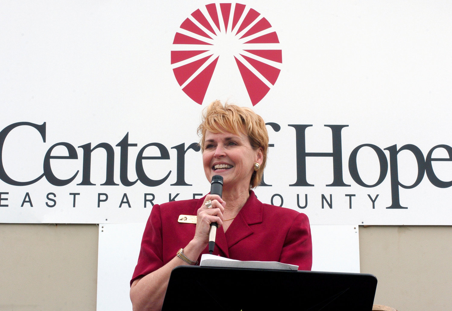 Lynn McKinney, assistant school superintendent for special programs and a liaison to the Texas Homeless Education Department, addresses a group of about 30 who, on Friday, attended the grand opening of the Center of Hope-East Parker County in 2005.