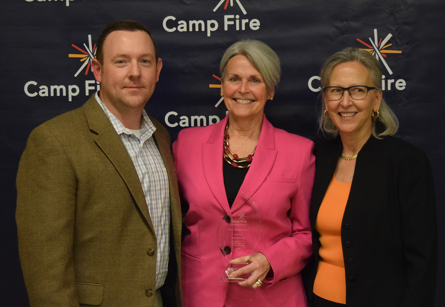 Camp Fire Board member Russ Morris, Lynn McKinney, and Cathy Halliday, Vice President of Youth Development for Camp Fire.