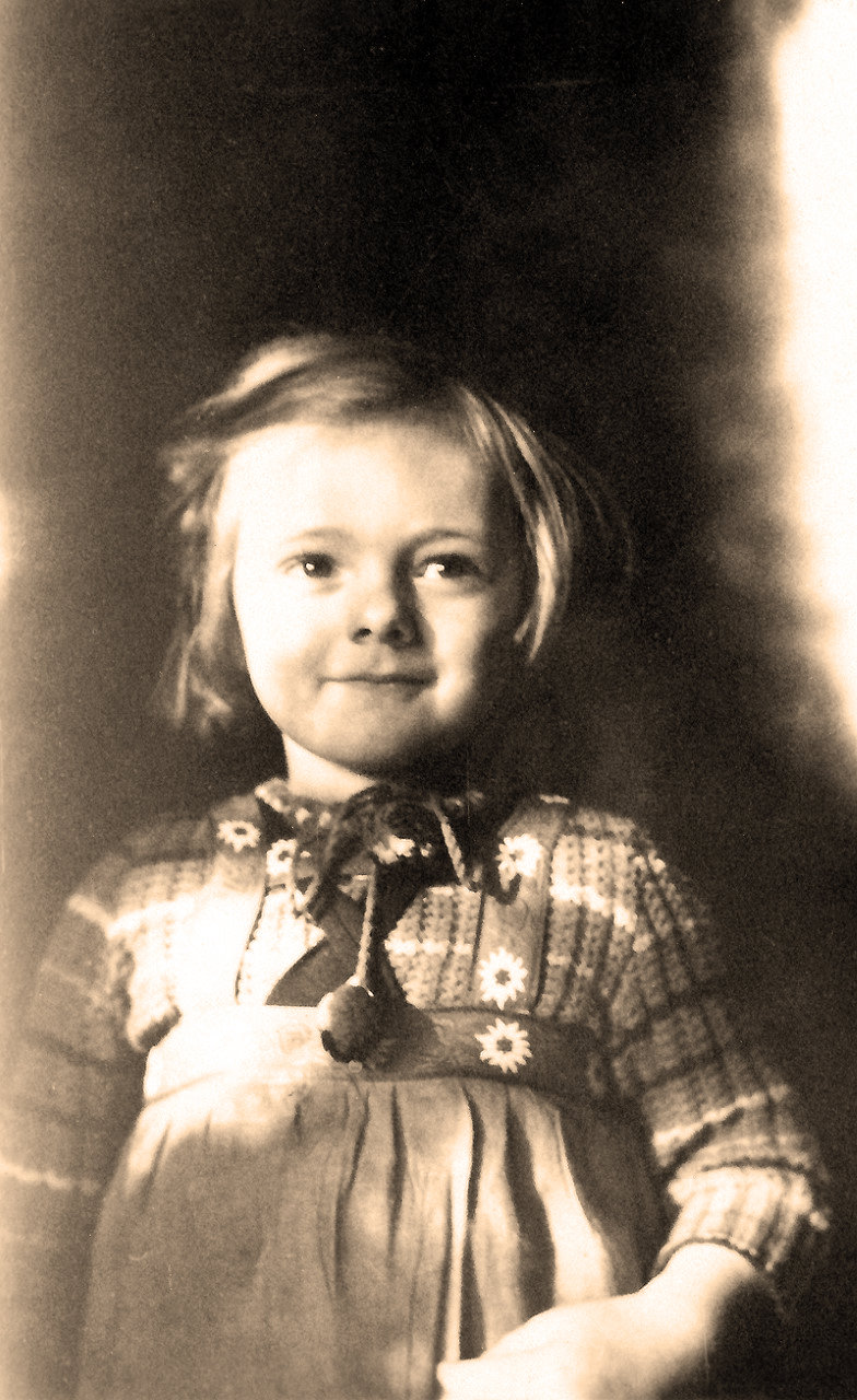 'Katie' Gisela Schwantje sporting a sweater made by her mother.  As was customary, Gisela received a 'Schultüte' (candy-filled cone) for this, her first day of school in Germany (April 14, 1941).  Oddly, her oldest son would be born exactly 19 years later.