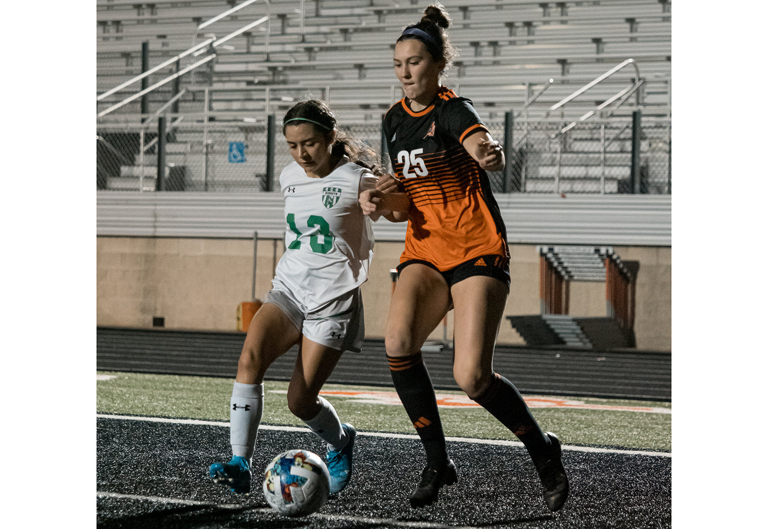 Georgia Zirbser works an Azle defender near the goal during the first half of the Ladycats 5-0 win on Tuesday, March 7.
