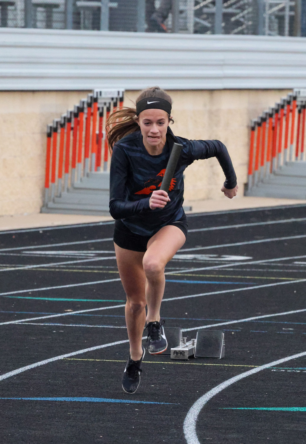 Emery Thompson runs her leg in the 1600 relay.