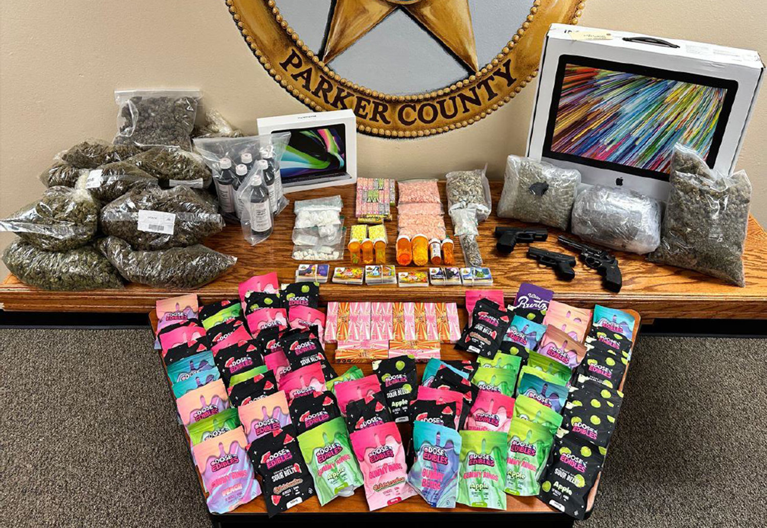 Parker County Special Crimes Unit investigators seized weapons, electronics, and more than $116,000 in illegal narcotics, including suspected methamphetamine, Adderall, cocaine, Alprazolam, Hydrocodone, MDMA, Psilocybin (mushrooms), Promethazine, hydroponic marijuana, and THC cartridges, wax, and edibles from the home of Isaiah Marquis Christopher.
