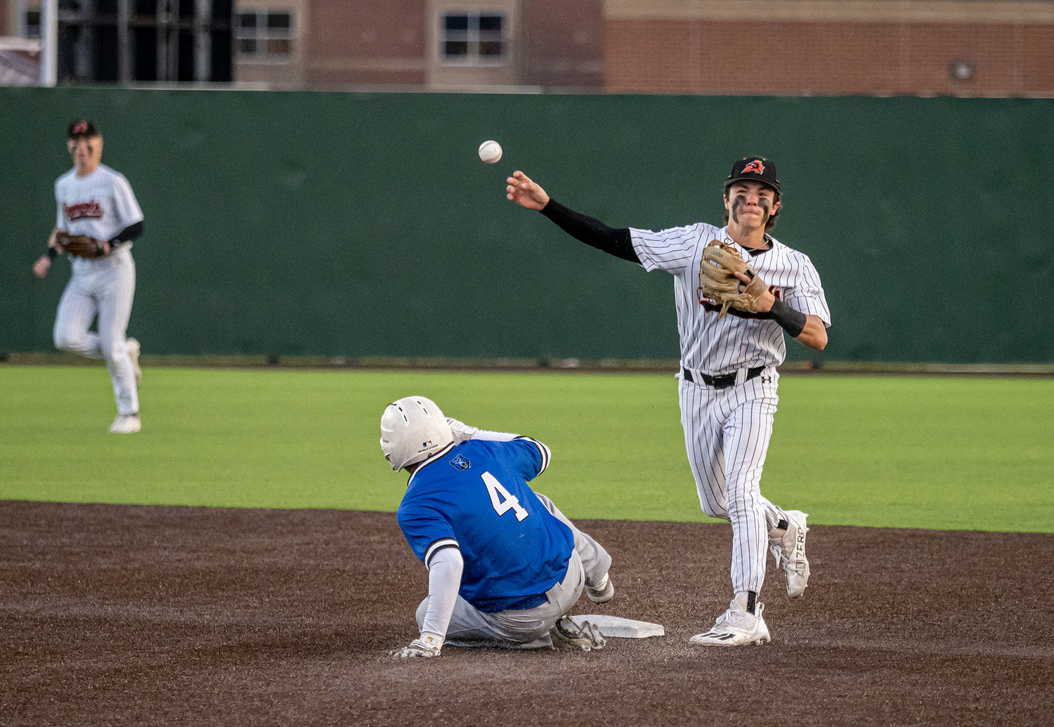 Boyd Thompson successfully turns the first half of a 6-4-3 double play to end Brewer's half of the second inning in the District opener on Tuesday, March 21. The Bears defeated Aledo, 3-1.