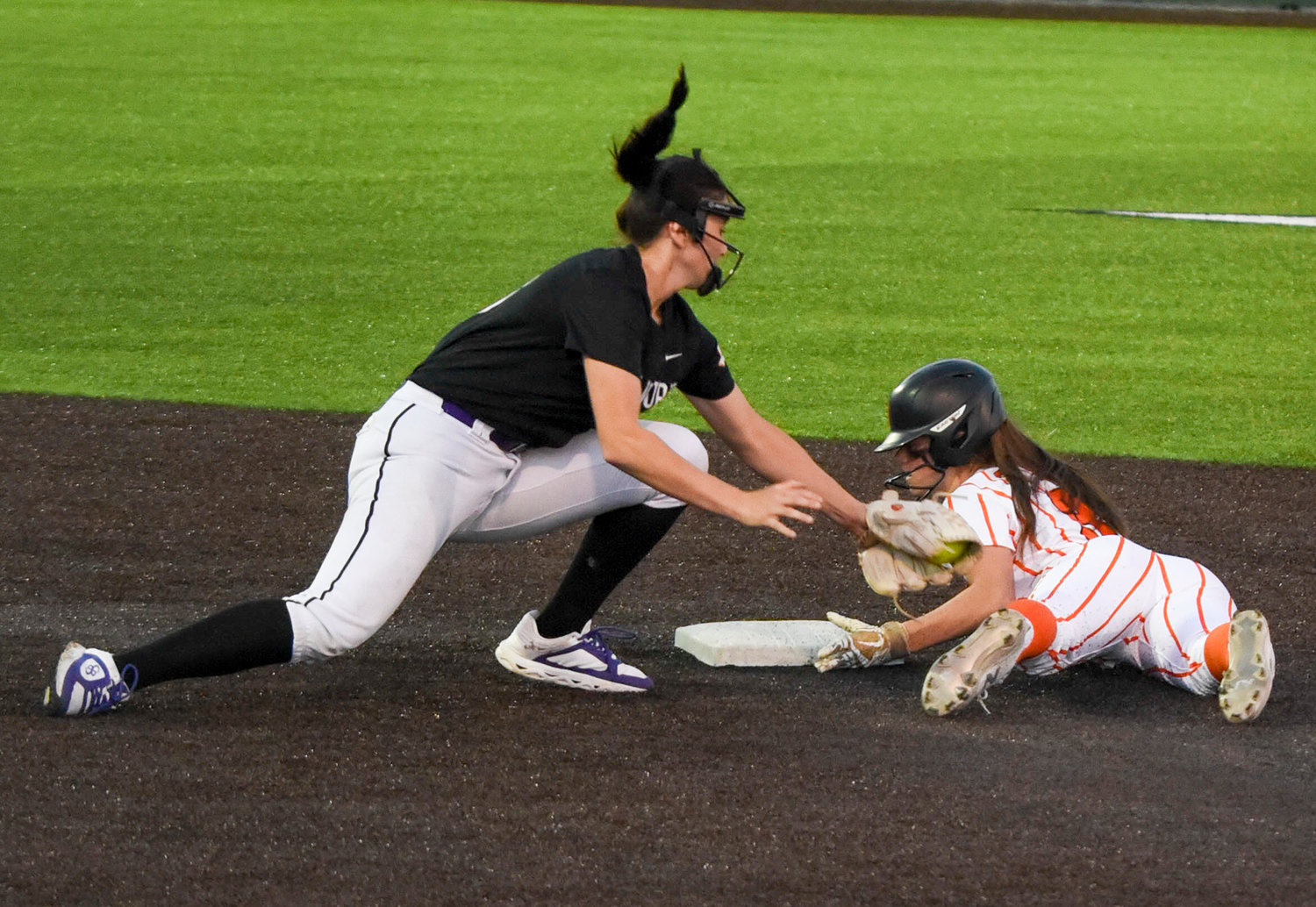 Senior Reagan Davis slides safe into second base Friday, March 24, against the Granbury Pirates. The Ladycats went on to dominate the Pirates 10-1.