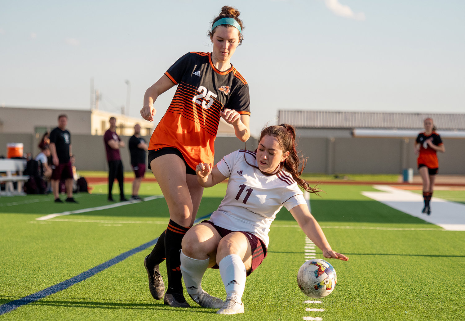 Georgia Zirbser battles a Northside player for control of the ball near the sideline in the bi-district matchup on Friday, March 24. The Ladycats won the match 6-0 to advance in the playoffs.