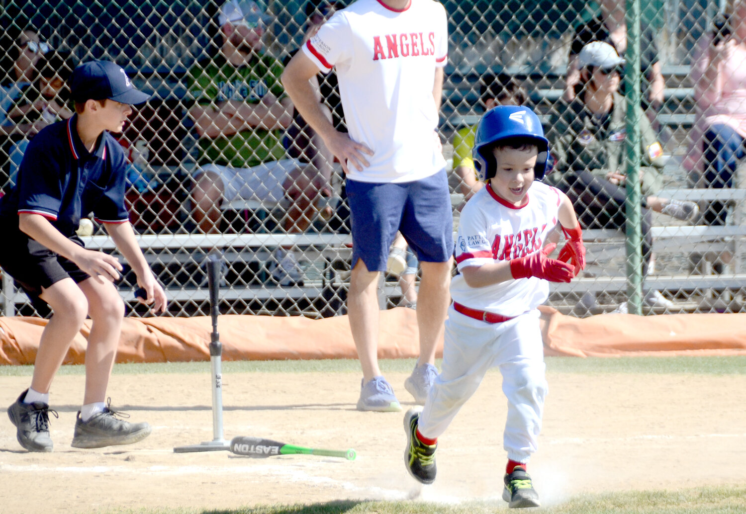 Ryan Corcia of the Angels runs to first after a hit.