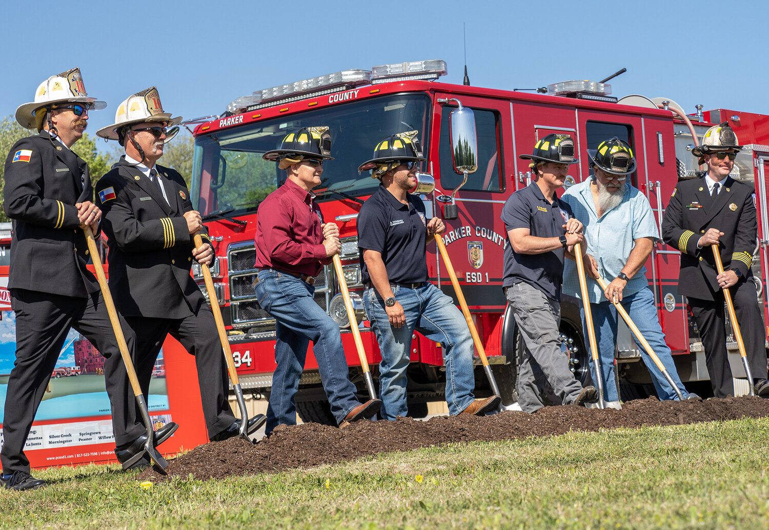 Members of ESD 1 prepare to symbolically break ground for the new training facility off of Farmer Road during a ceremony on Friday, April 21.