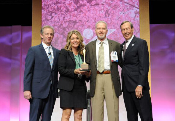 Julie Turner and her husband Lance (second from right) accept their award as Franchisees of the Year from Express Employment Professionals at the company's International Conference. Pictured with them are John Culpepper, from Athens, Georgia, the 2022 Franchisee of the Year, and Express CEO and founder Bill Stoller..