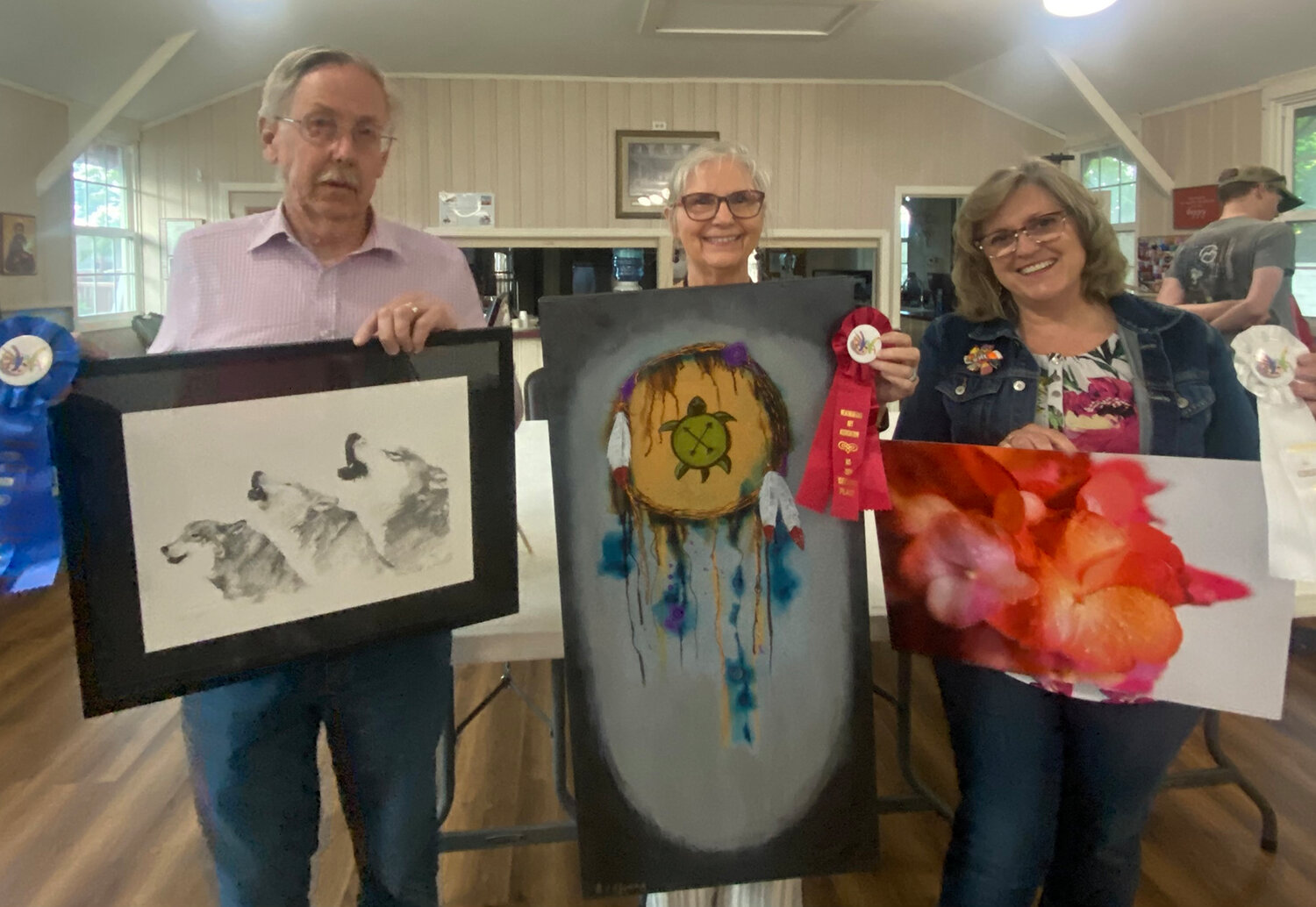 Michael McCarty (left), Carolyn Young (center), and Carmen Davailus were the top award winners in the Weatherford Art Association May contest.