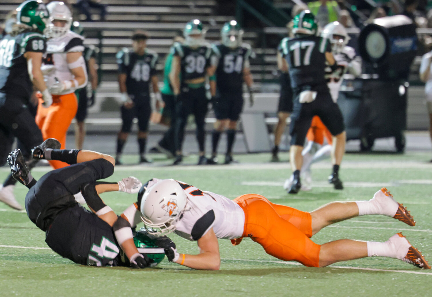 Linebacker Kutter Harrell is in on a tackle against Azle.