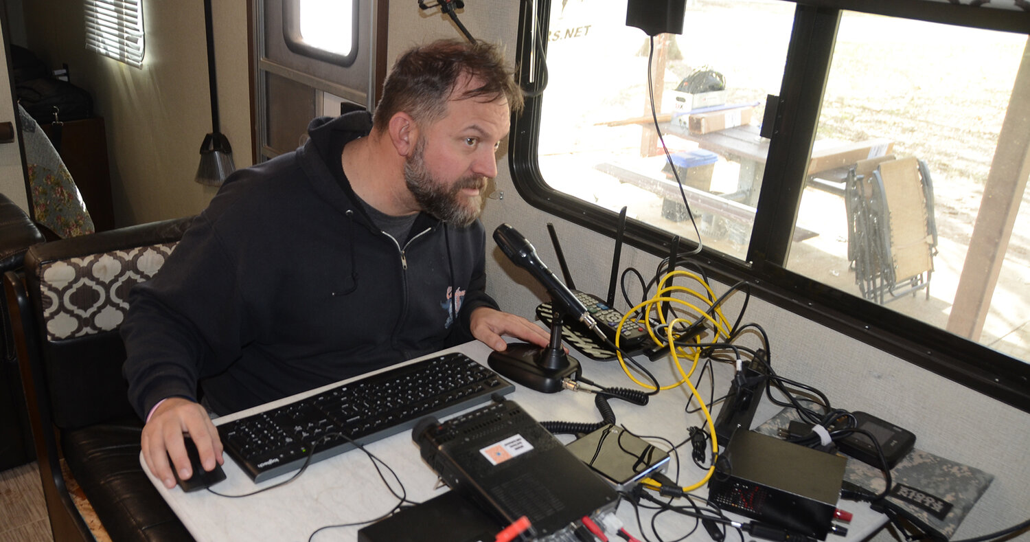 Aledo ISD Police Sergeant Cliff Boltwood makes contact with a radio operator from Connecticut during a national amateur radio operator “field day.”