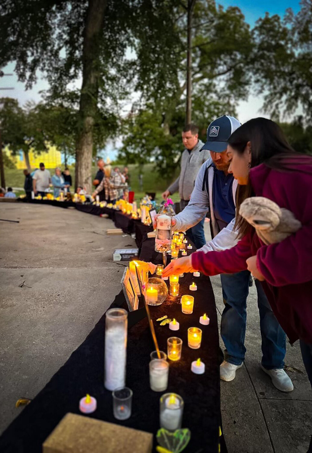 Grieving parents gather to remember their lost children as part of an event sponsored by the non-profit A Memory Grows.