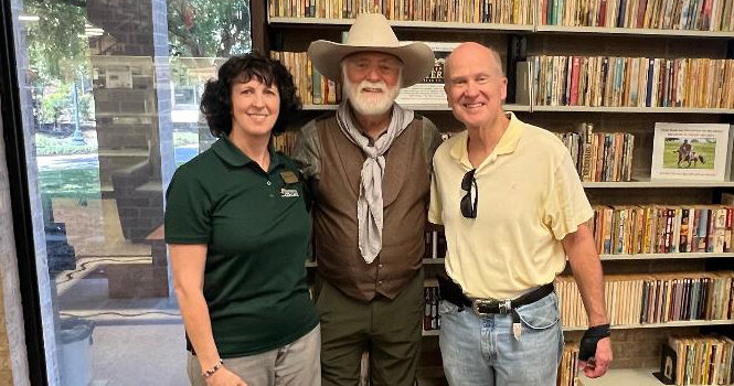 Weatherford College library director Valorie Starr, Michael Murphey, and physician and friend Dr. Stephen Brotherton at the opening of the Murphey Western Institute Collection in March.