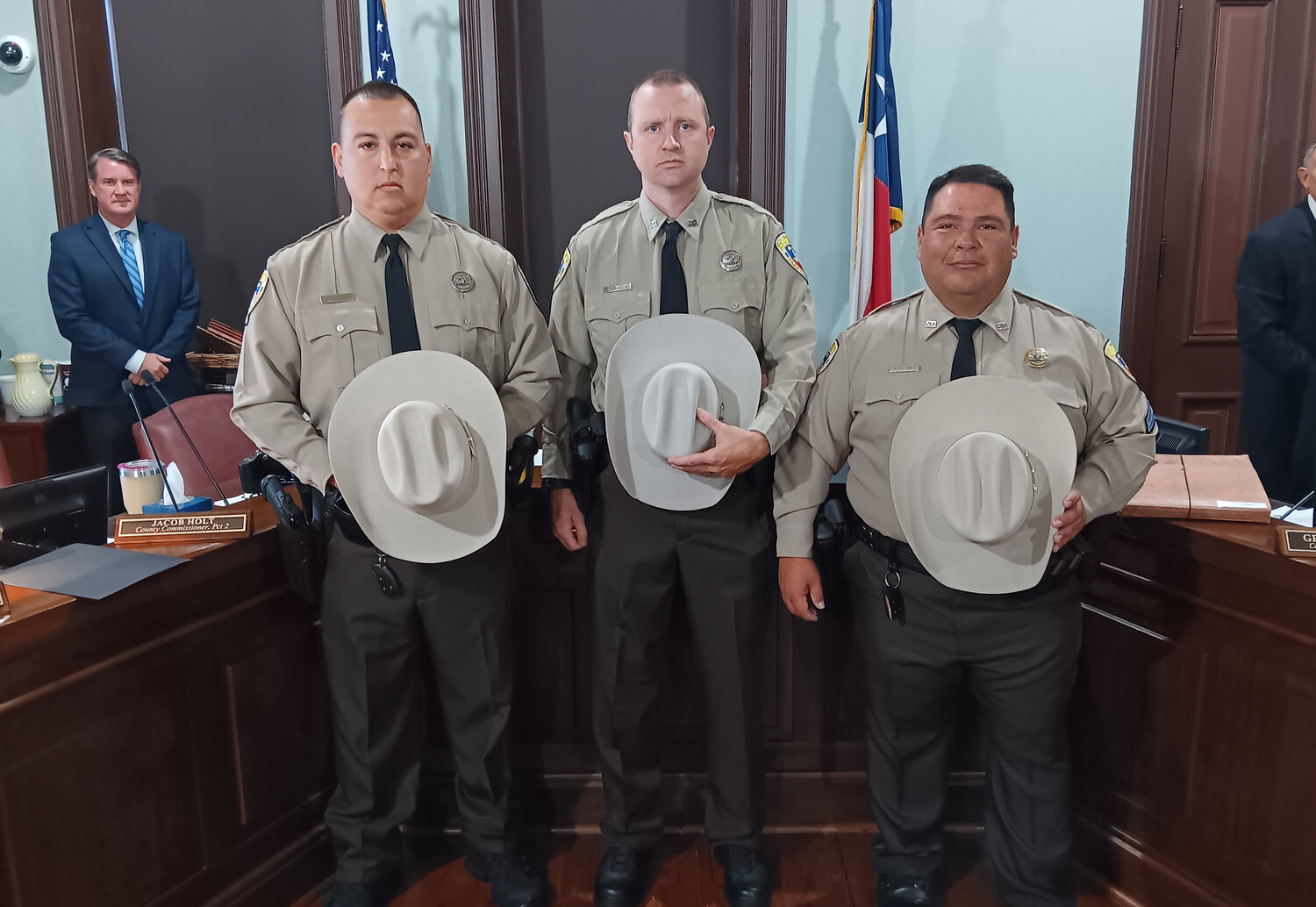 Parker County Sheriff’s Deputies (from left) Joseph evans, Randy Lawson and Corporal Luis Montanez were recently awarded with the Life-Saving Award during a Parker County Commissioners Court session. They received the honor after saving the life of a suspect following a shootout.
