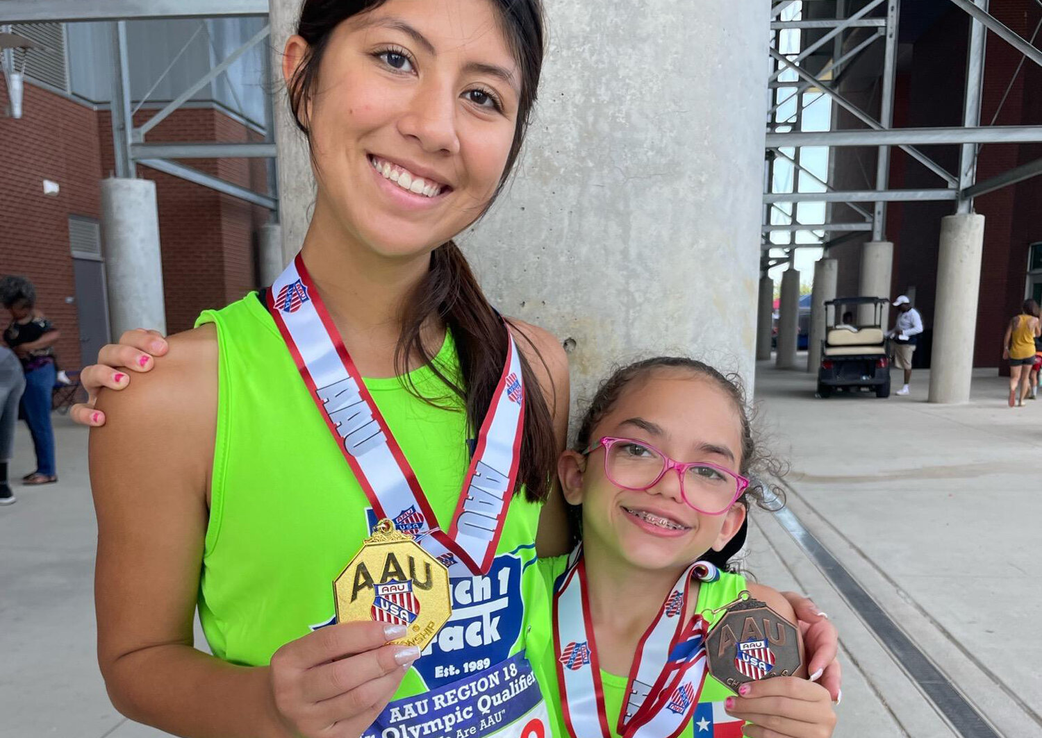 Emmy Strathmeyer (left) qualified in three events and Jenna Fink advanced in two for the upcoming Amateur Athletic Union Junior Olympics in Greensboro, North Carolina July 29-Aug. 3. In all, Mach I Track Club qualified four for the AAU meet, along with two for the USATF Junior Olympics in Bryan-College Station July 22-28.