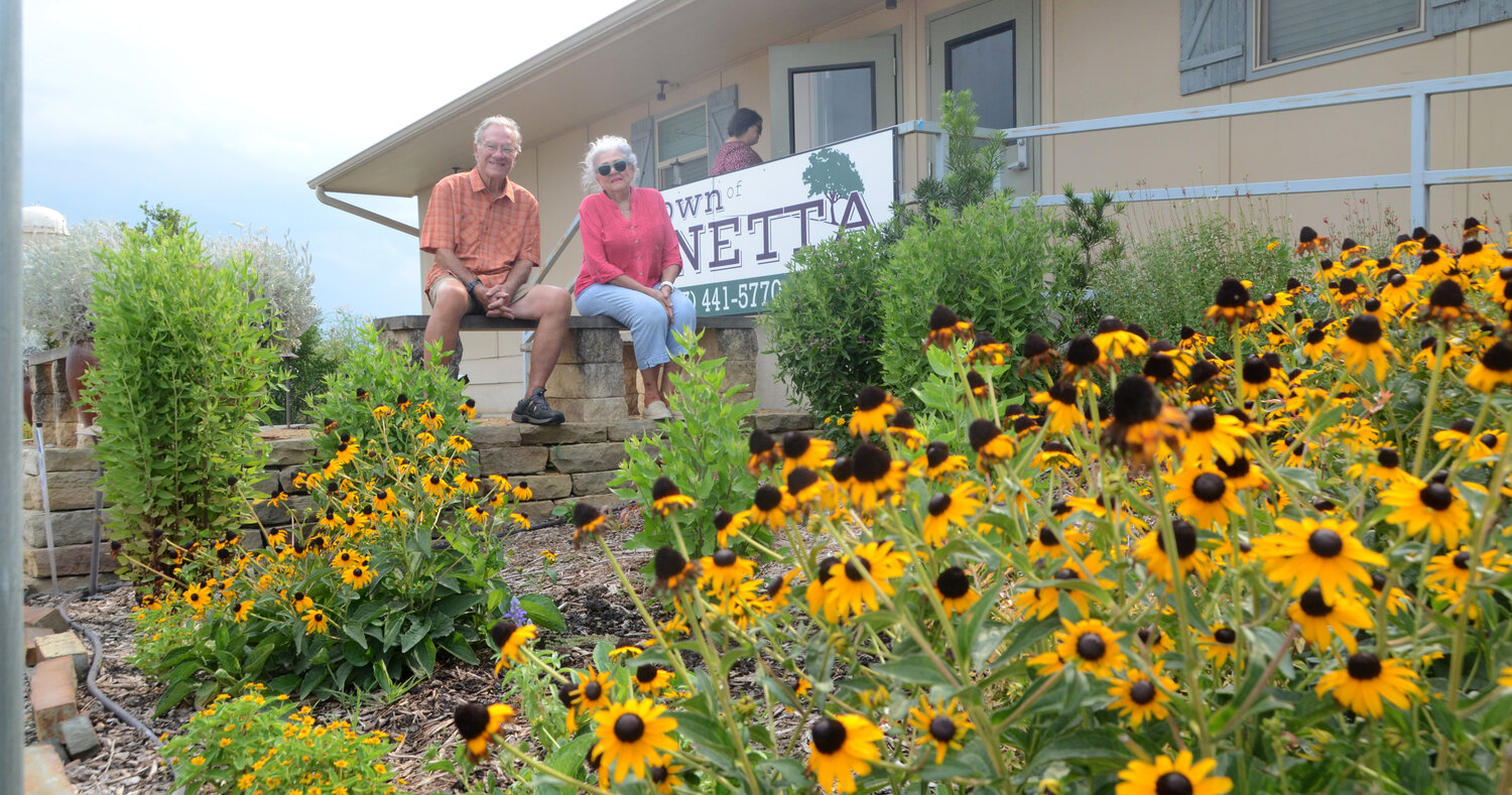 Gay and Rolf Larson enjoy the garden they helped establish with other Parker County Master Gardeners at Annetta City Hall.