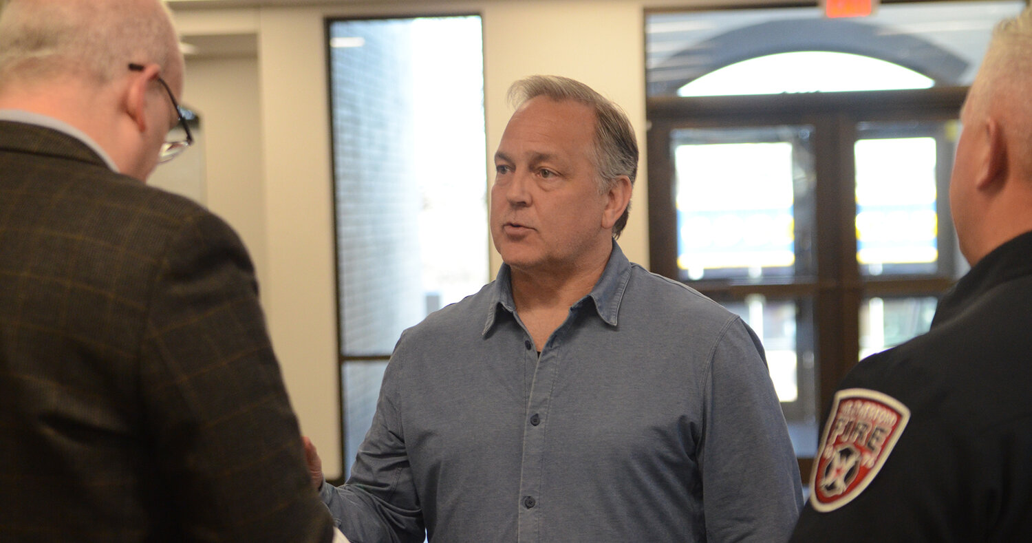 Kioti Tractor general manager Bryan Welch speaks with Weatherford Director of Development Services Kaleb Kentner in the lobby immediately after his company was approved by the Council to move into a new location at 1435 Fort Worth Hwy.