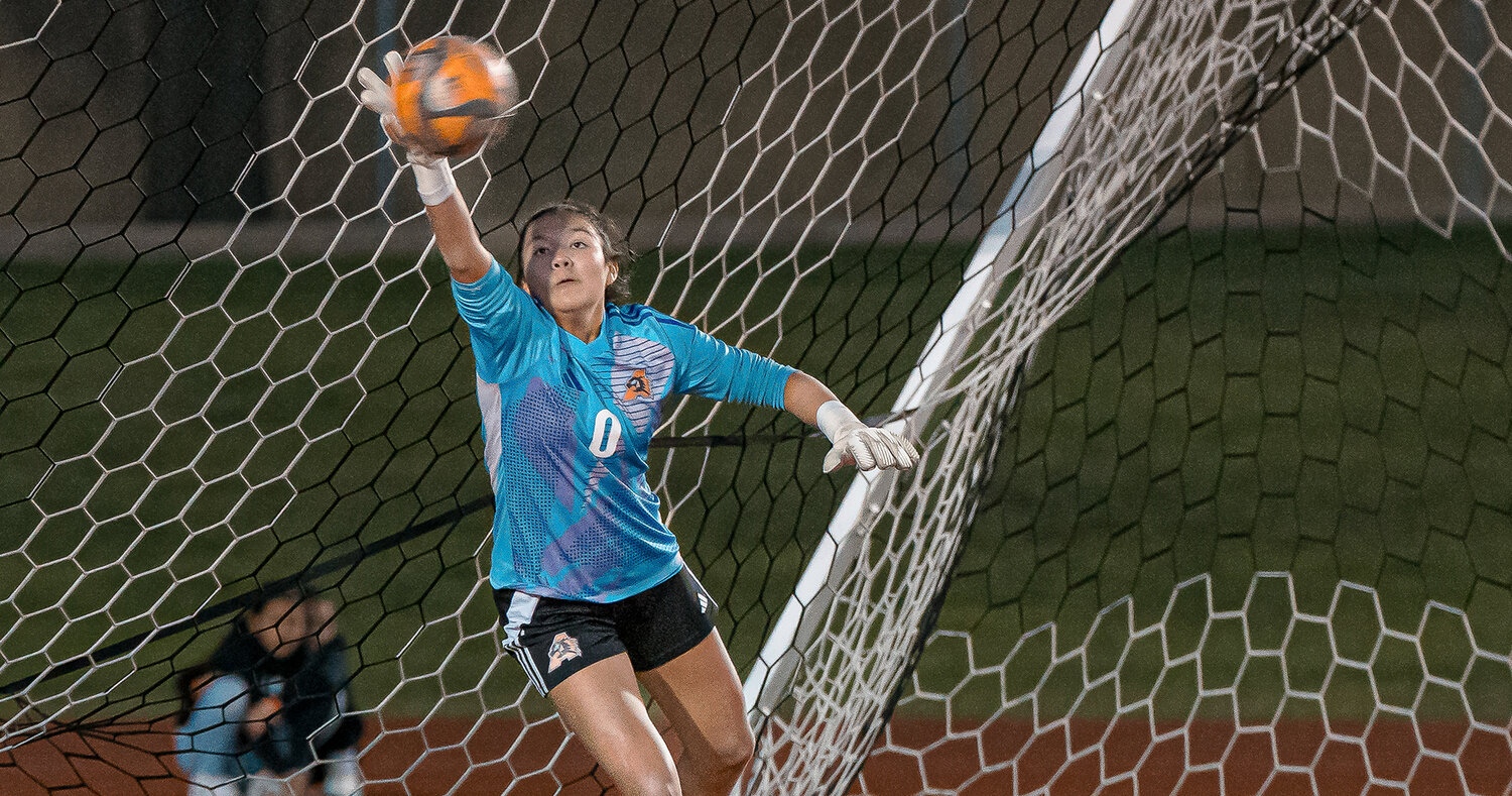 Audrey Obana saves a goal during the shootout of the Ladycats' bi-district match against Birdville on Thursday, March 20. Obana collected 16 saves during the match before being credited with a pair of stops in the shootout.