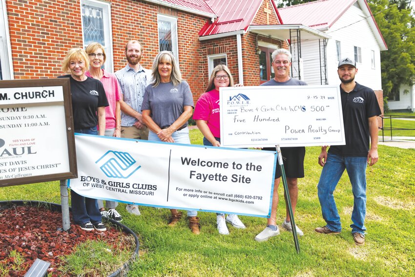 Left to right: Realtors Lisa Woolridge, Drew Goser, and Donna Adams, Boys and Girls Club Site Director Miranda Atwood, Power Realty Broker/Owner Jeff Radel, and realtor Justin Radel.