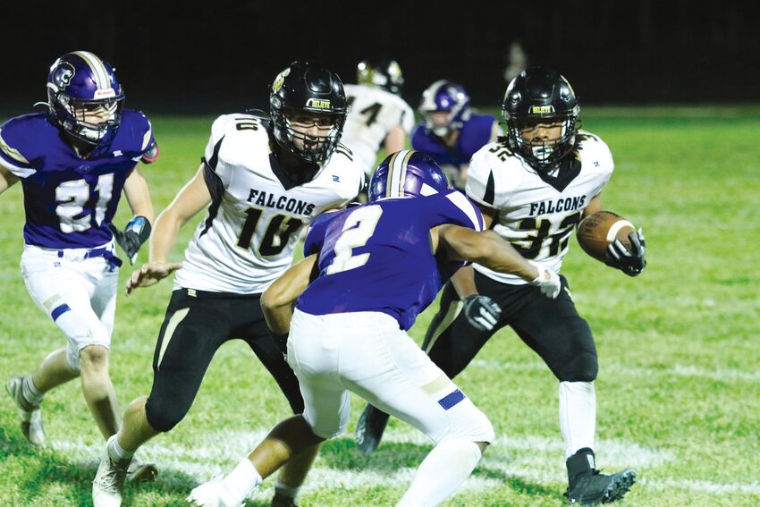 Fayette senior running back Micah Estes looks for room as he gets a block from Colton Cross.