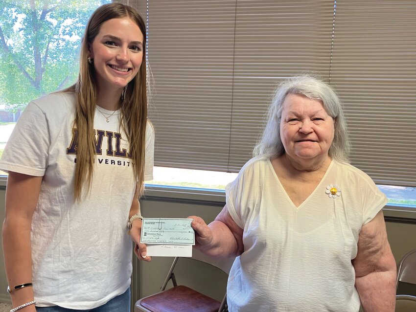 Oakleigh Hill (left) receives her scholarship from Kitty Overstreet, Vic President of PEO Chapter NN in Fayette.