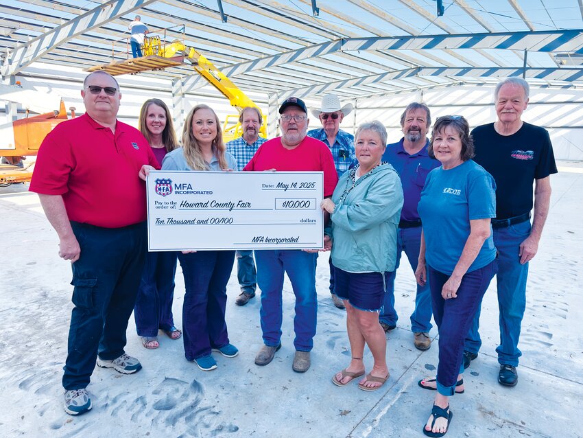 Members of the Fairgrounds Development Association accepted a $10,000 grant from the MFA Charitable Foundation inside the new metal building at the fairgrounds on Wednesday, May 14. Front row, left to right: Larry Kramm (Manager, Fayette MFA), Jerri Jones (MFA), Darrell Hendrix (FDA President), Sherri Dobson (FDA, grant writer), and Leigh Hildebrand (FDA Fundraising Committee). Back row: Jinger Felten (FDA Secretary), Warren Schlotzhauer (FDA Board Member), Dr. Ken Vroman (FDA Board VP), Larry Schlotzhauer (FDA Board Member), and Randy Hart (FDA Board Member).