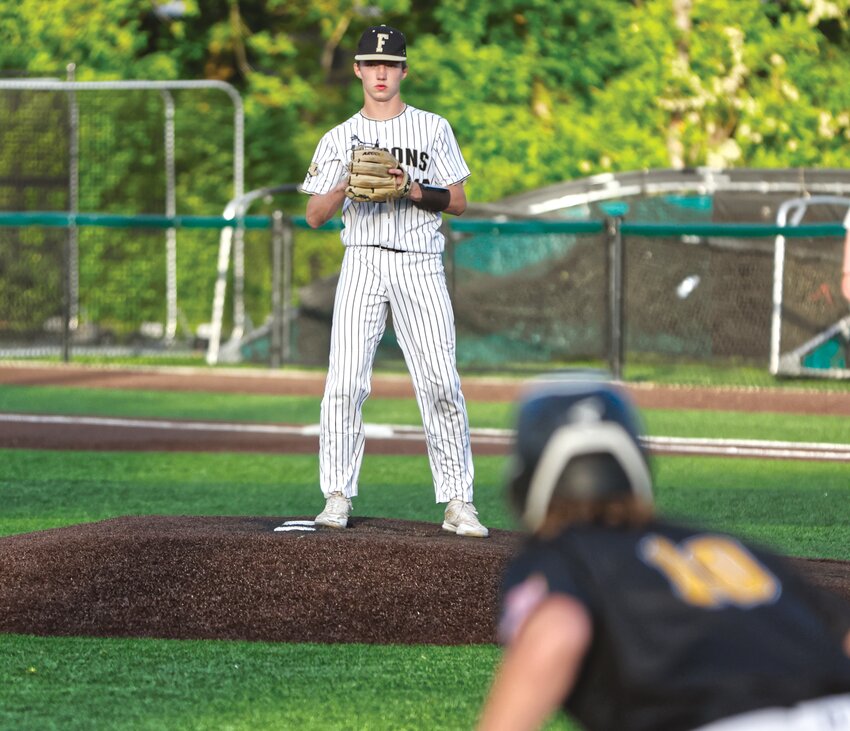 Fayette starting pitcher Ethan Bean checks the Marceline runner at third.
