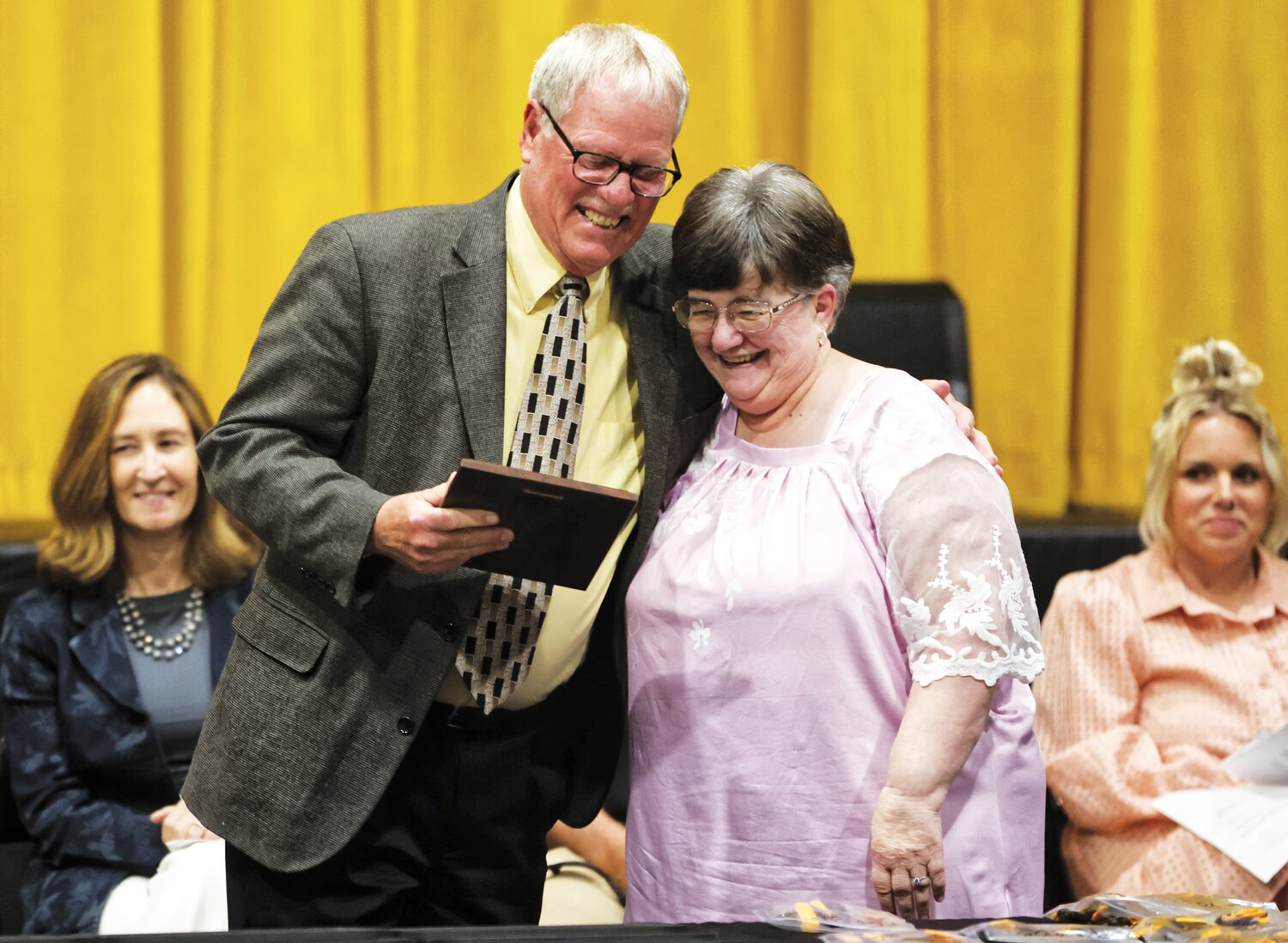 Fayette Board of Education President Skip Vandelicht presents the annual Distinguished Citizen of the Year award to Janet O’Neill.