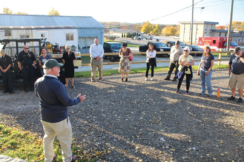 Scott McDonald officiated at the dedication of the trail in front of a new sign.