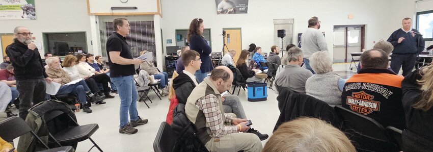 Hooksett Fire Chief Steven Colburn speaks to the residents at the deliberative session of Town Meeting on Saturday, Feb. 1. Many people lined up to question the need for two new fulltime firefighters.